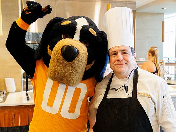 Smokey the UT mascot with an Aramark chef